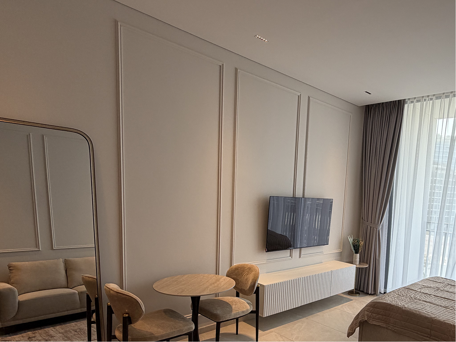 Completed residential living space with wall mouldings and fitted media storage